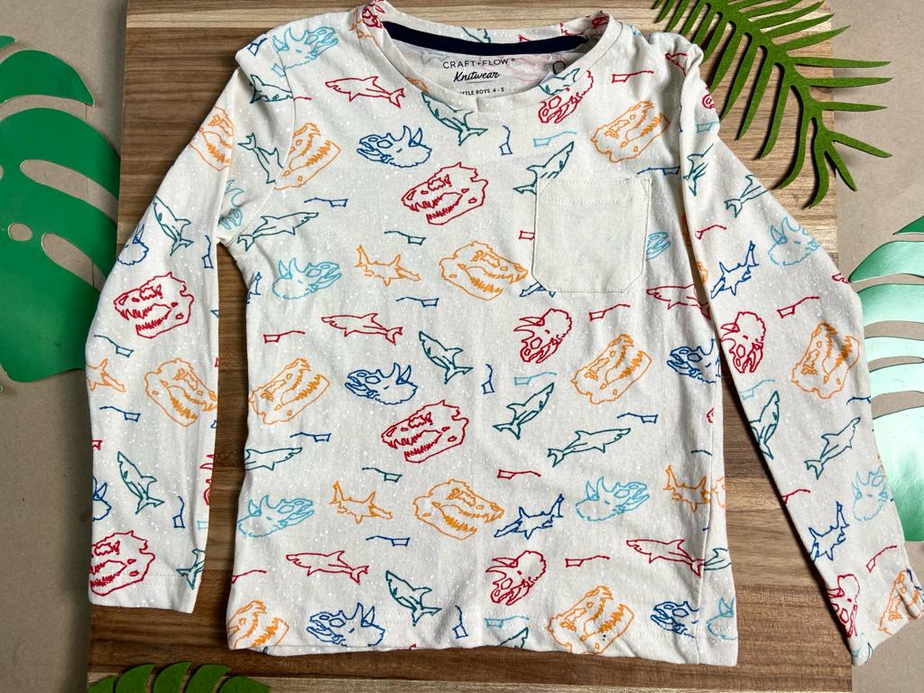 Camiseta beige con dinos de colores